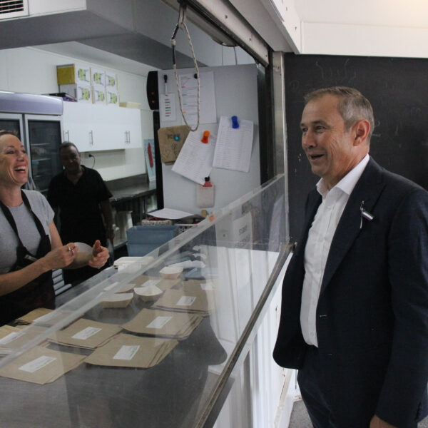 The Premier of WA speaks to the Canteen Manager.